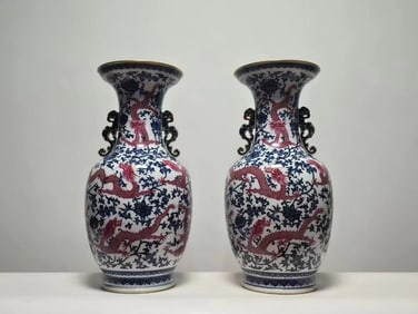 A PAIR OF QING DYNASTY BLUE AND WHITE ROUGE-RED DRAGON VASES
