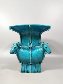 A QING DYNASTY PEACOCK BLUE GLAZED FOUR-SHEEP VASE