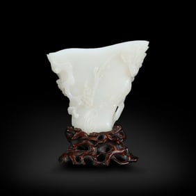 Qing Dynasty Hetian white jade cup in the shape of a plum blossom stump