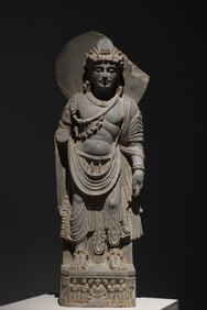 A Gandhara-style stone-carved standing Buddha statue