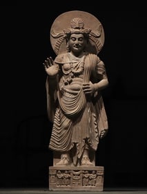 A Gandhara-style stone-carved standing Buddha statue
