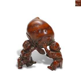 Qing Dynasty Bamboo carving of a boy presenting longevity gifts, made by Chen Tianzhang