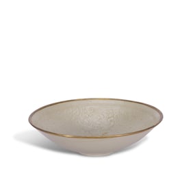 Song Dynasty Ding kiln white-glazed bowl with molded kui-dragon and floral patterns