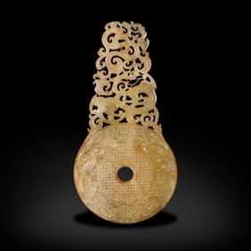 Han Dynasty Jade bi with dragon and phoenix patterns and protruding outer edge