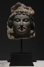 A Gandhara-style stone-carved Buddha statue