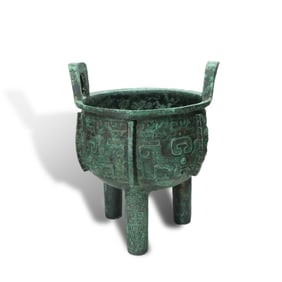 Shang Dynasty Bronze tripod cauldron with taotie