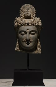 A Gandhara-style stone-carved Buddha statue
