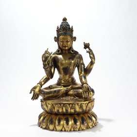 GILDED BRONZE FOUR-ARMED GUANYIN STATUE