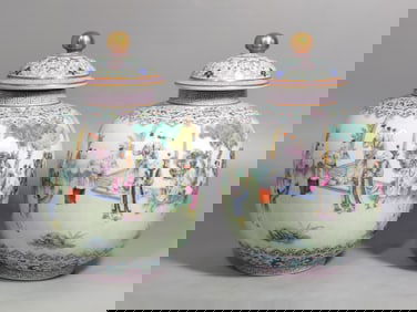 A PAIR OF FAMILLE ROSE COVERED JARS WITH A CONTINUOUS SCENE OF CHILDREN AT PLAY, DATING FROM THE