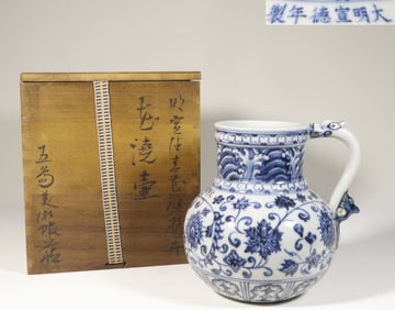 MING DYNASTY HAND-PAINTED BLUE AND WHITE FLOWER WATERING POT WITH SCROLLING FLORAL DESIGN