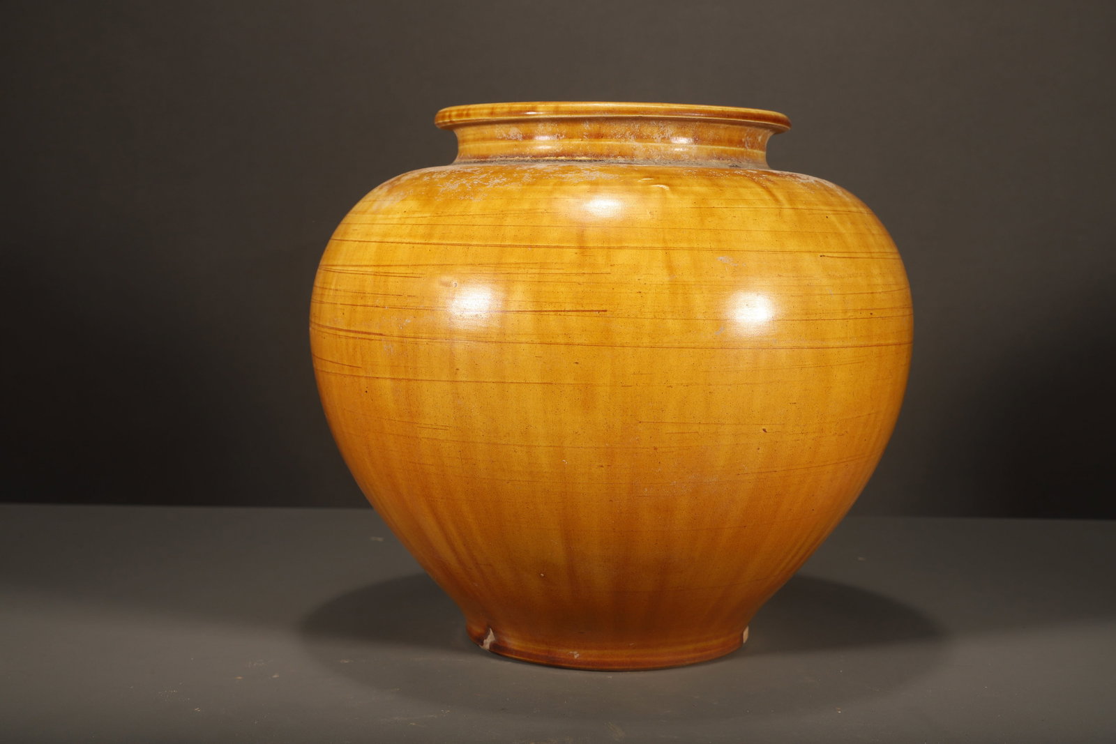 TANG DYNASTY YELLOW GLAZED JAR: Name TANG DYNASTY YELLOW GLAZED JAR Dimensions H:20.5CM Condition Additional photographs and condition reports are available upon request as a courtesy to our clients. Any condition report