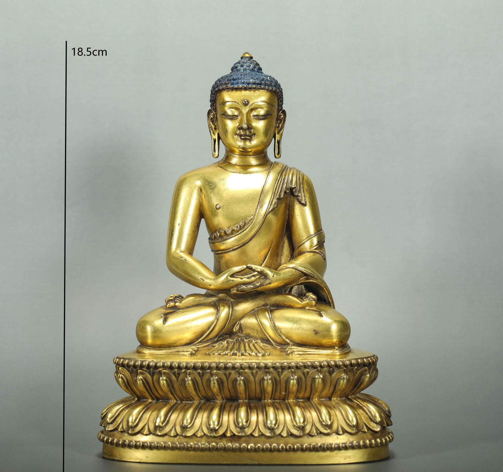 GILT BRONZE SHAKYAMUNI BUDDHA FROM THE MING DYNASTY: Name GILT BRONZE SHAKYAMUNI BUDDHA FROM THE MING DYNASTY Dimensions H:18.5CM Condition Additional photographs and condition reports are available upon request as a courtesy to our c