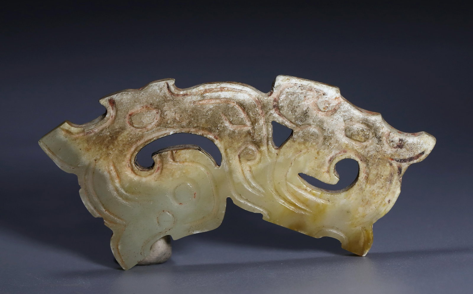 WESTERN ZHOU DYNASTY JADE DRAGON PENDANT: Name WESTERN ZHOU DYNASTY JADE DRAGON PENDANT Dimensions H:2CM L:5CM Condition Additional photographs and condition reports are available upon request as a courtesy to our clients. A