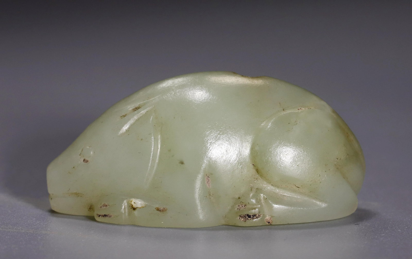 TANG DYNASTY JADE RABBIT: Name TANG DYNASTY JADE RABBIT Dimensions H:1.54CM L:3.32CM Condition Additional photographs and condition reports are available upon request as a courtesy to our clients. Any conditi