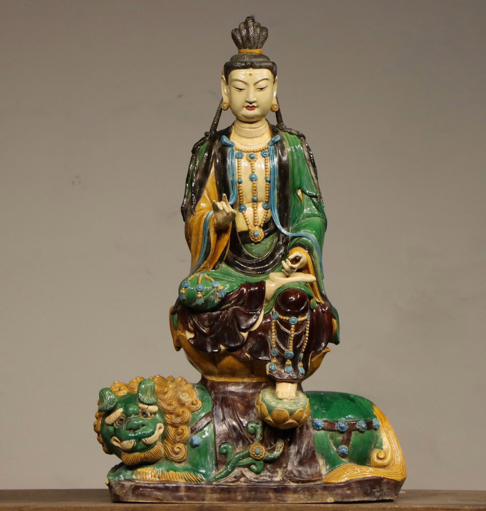 MING DYNASTY TRICOLOR GLAZED BODHISATTVA: Name MING DYNASTY TRICOLOR GLAZED BODHISATTVA Dimensions H:89CM L:57CM Condition Additional photographs and condition reports are available upon request as a courtesy to our clients.