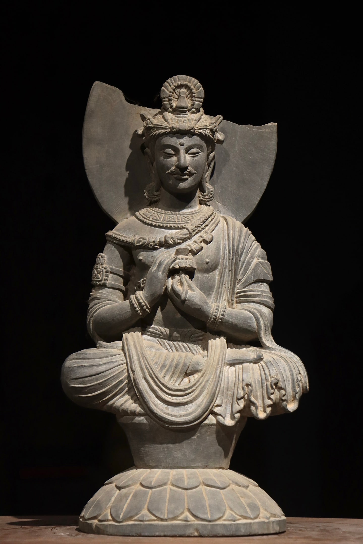 A Gandhara-style stone-carved seated Buddha statue (1 of 8)