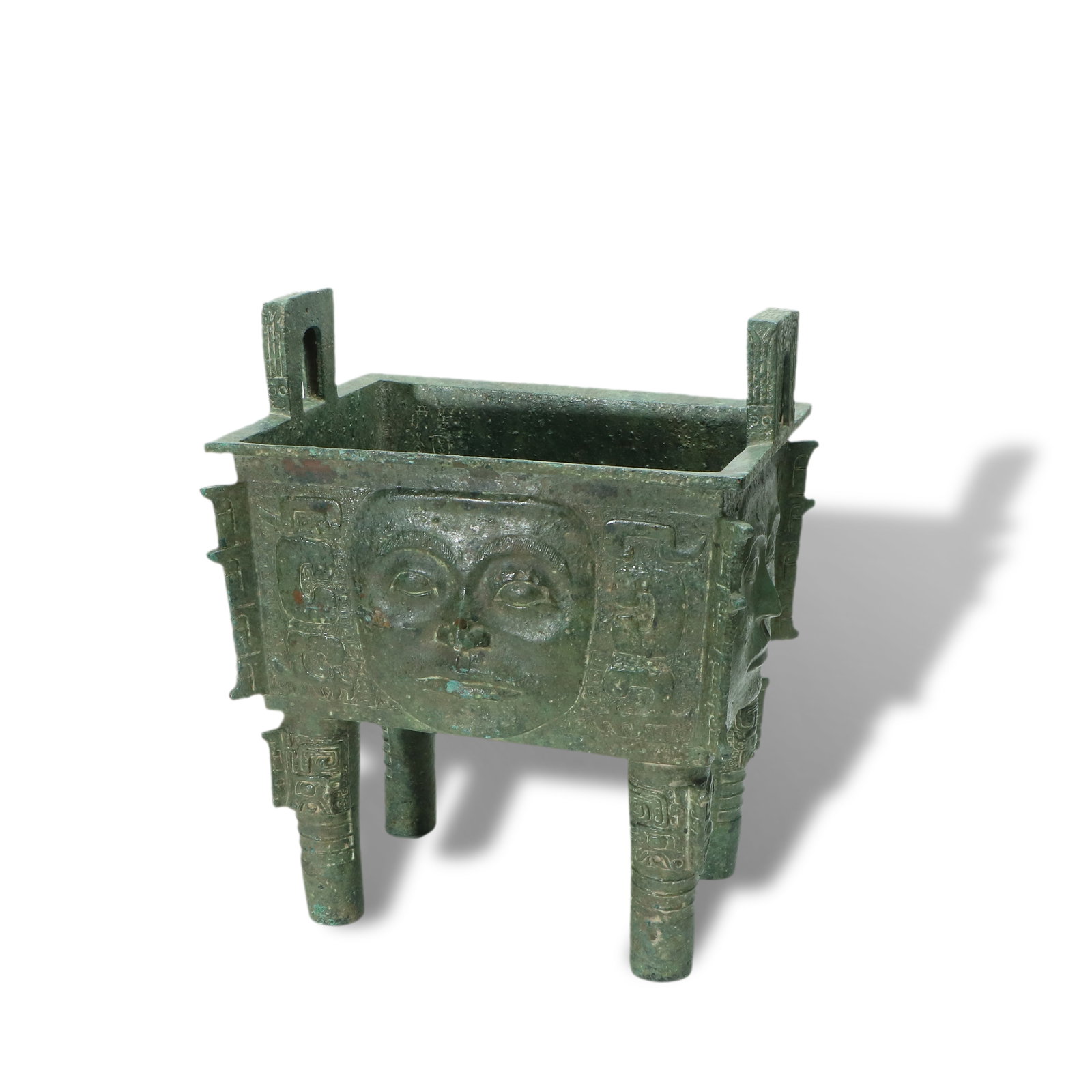 Shang Dynasty Bronze square ding tripod with human face motif (1 of 4)
