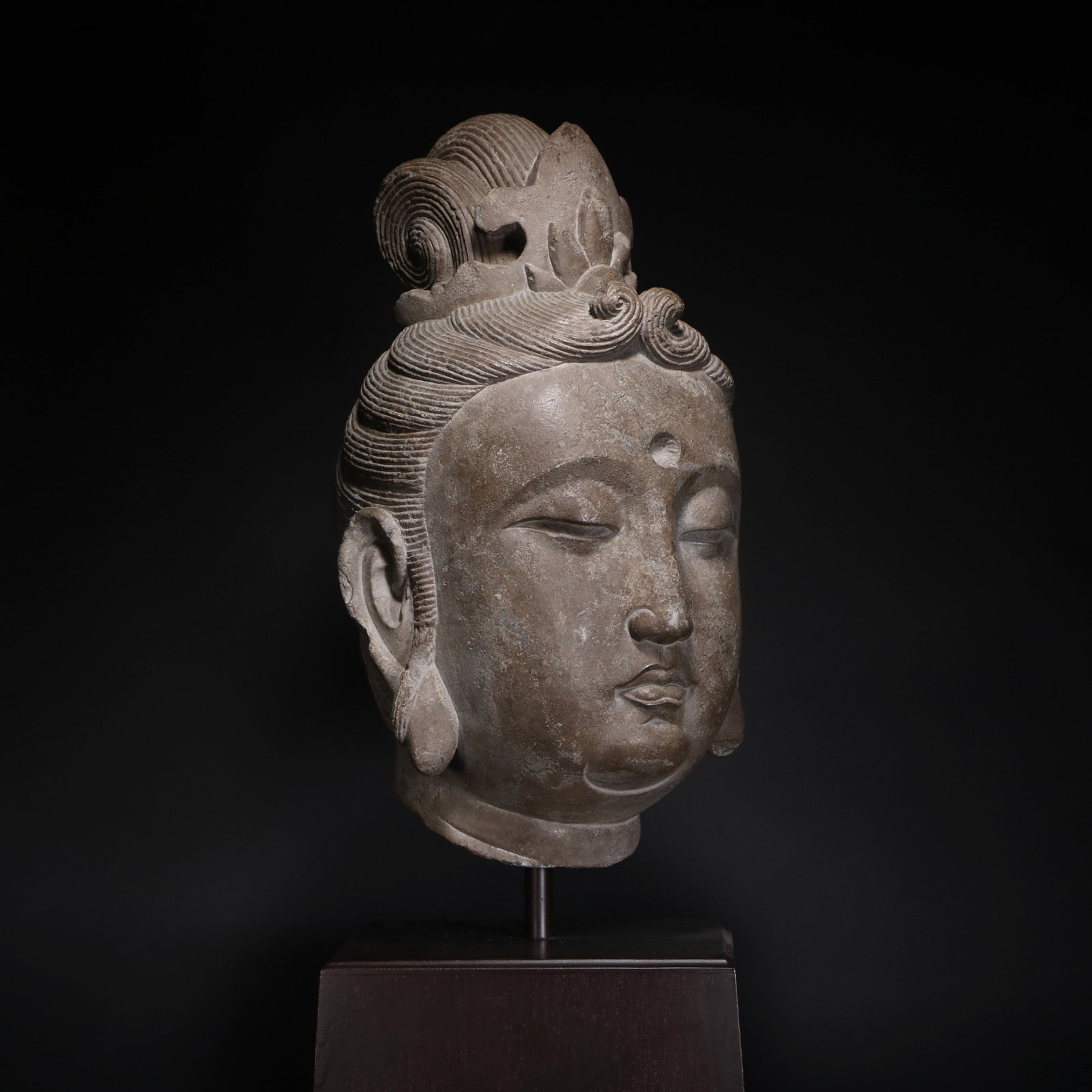 Tang Dynasty Stone Carved Buddha Head: Name Tang Dynasty Stone Carved Buddha Head Dimensions H:45cm W:24cm Condition Additional photographs and condition reports are available upon request as a courtesy to our clients. An