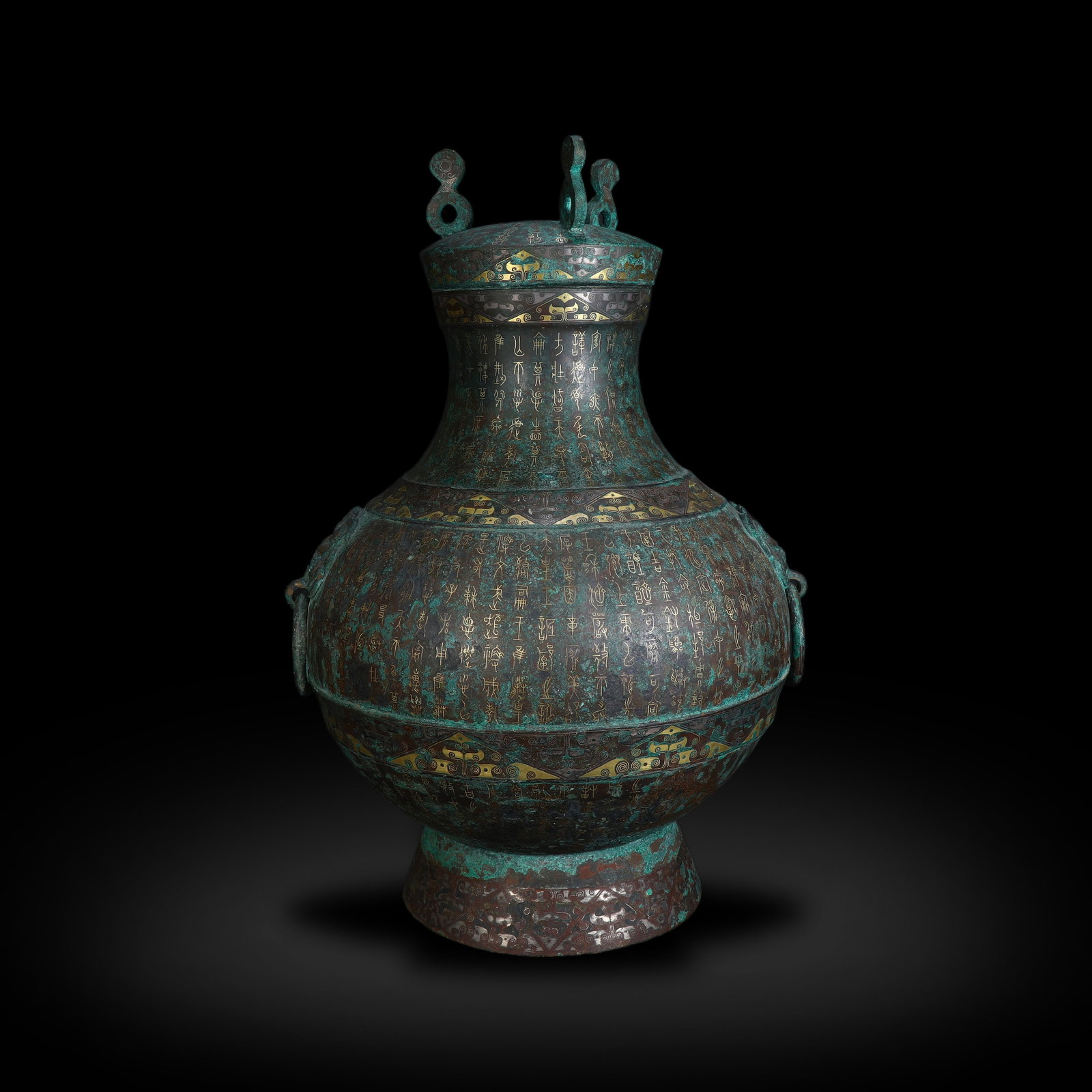 Warring States Period Bronze Hu Vessel with Gold and Silver Inlaid Inscriptions: Name Warring States Period Bronze Hu Vessel with Gold and Silver Inlaid Inscriptions Dimensions H:34.5cm W:24.5cm Condition Additional photographs and condition reports are available