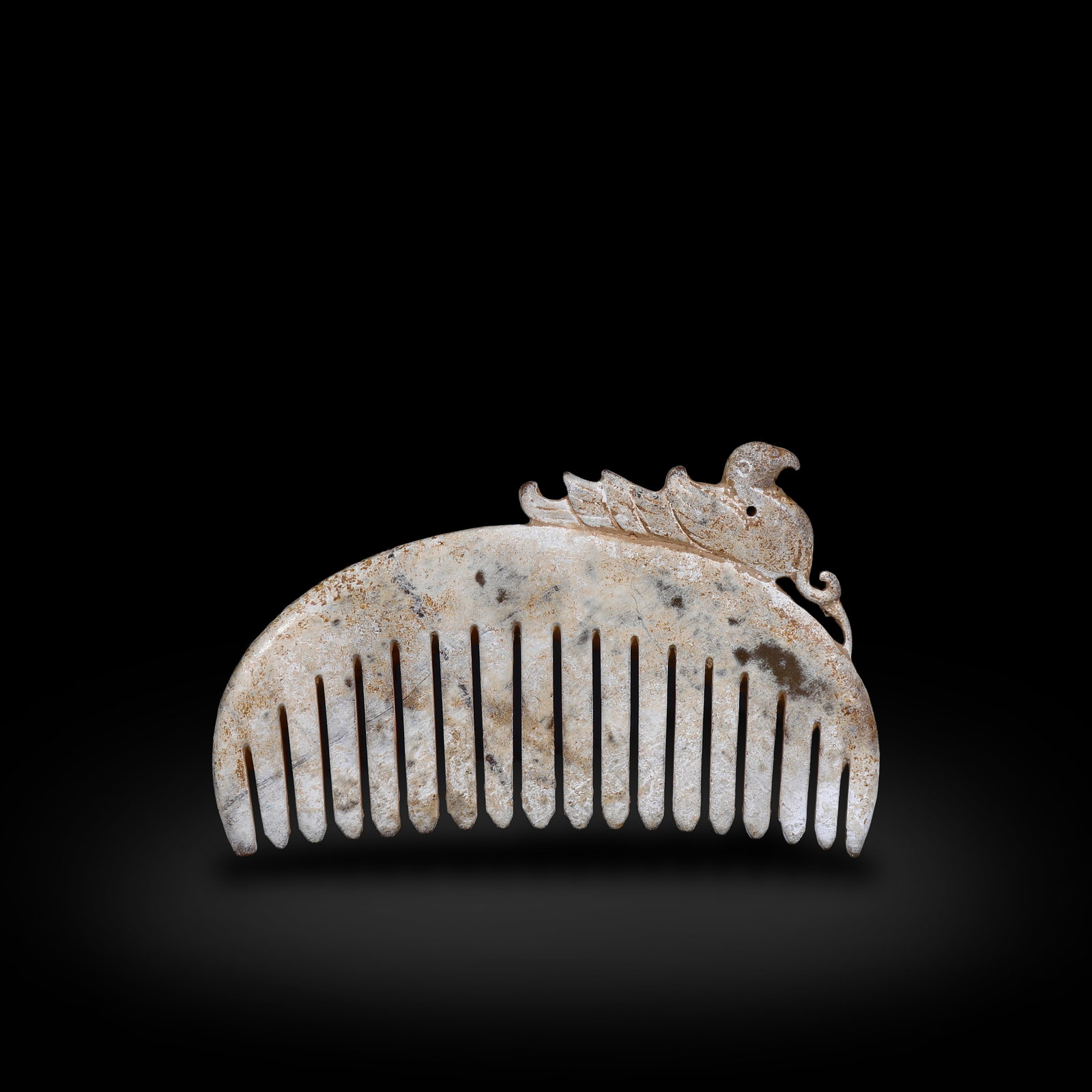 Warring States Period, Jade Comb with Phoenix Pattern: Name Warring States Period, Jade Comb with Phoenix Pattern Dimensions H:6.5cm W:10.4cm Description