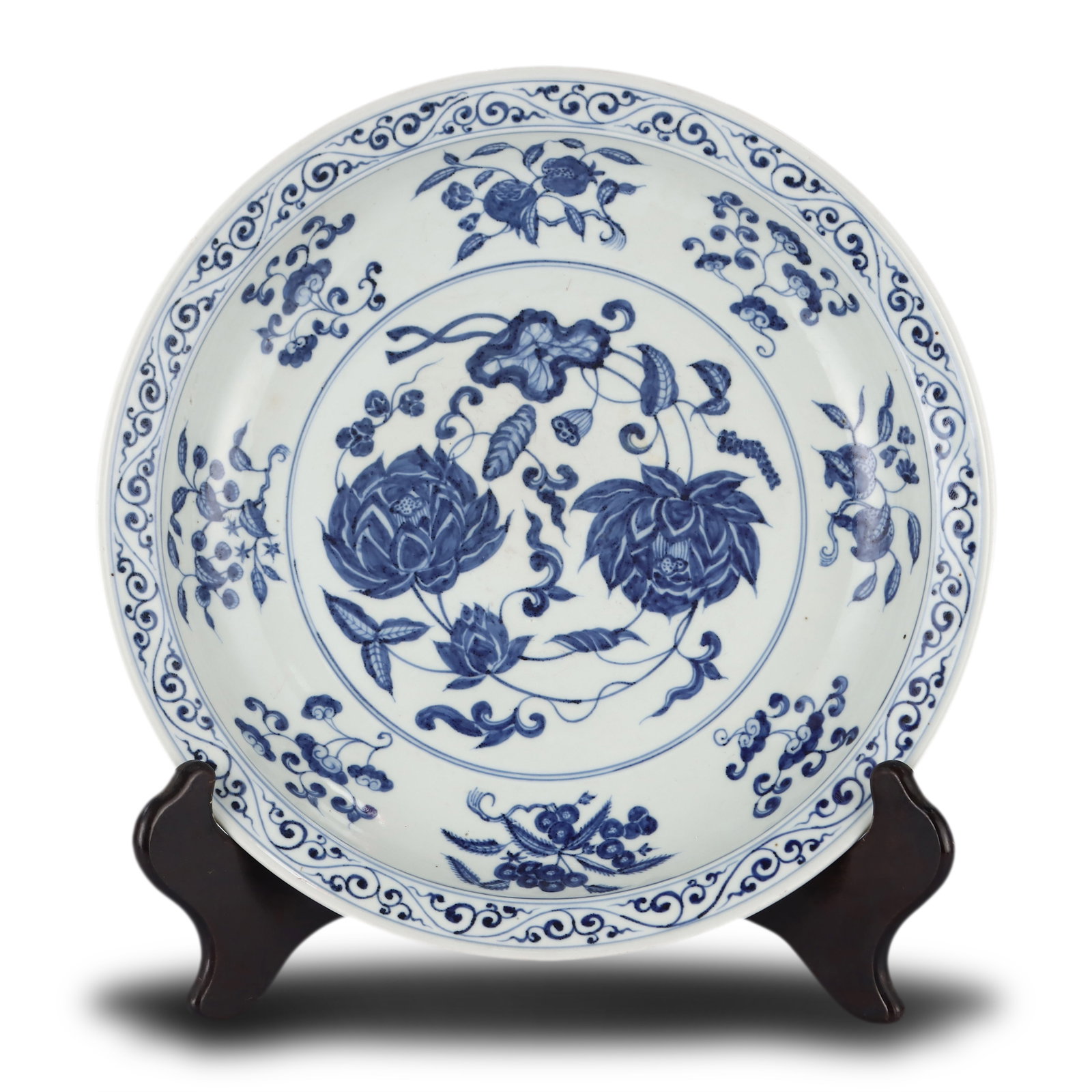 Ming Dynasty Yongle period, Large blue-and-white flared-rim plate with sprigged auspicious fruit and: Name Ming Dynasty Yongle period, Large blue-and-white flared-rim plate with sprigged auspicious fruit and double lotus patterns Dimensions D:39cm Description