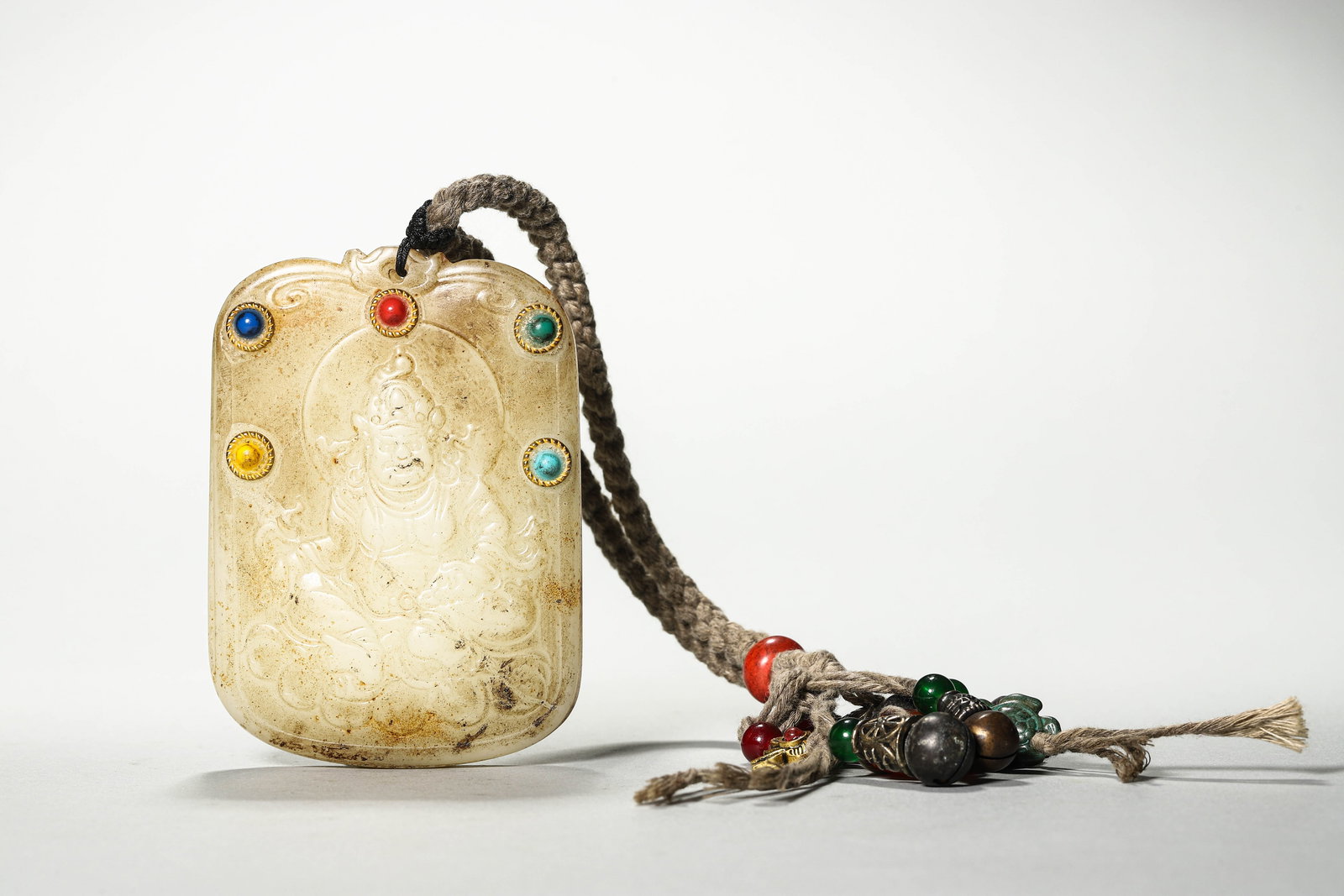 Qing Dynasty, Jade Plaque Inlaid with Treasures, Carved as Yellow Jambhala: Name Qing Dynasty, Jade Plaque Inlaid with Treasures, Carved as Yellow Jambhala Dimensions H:10cm W:7cm Description