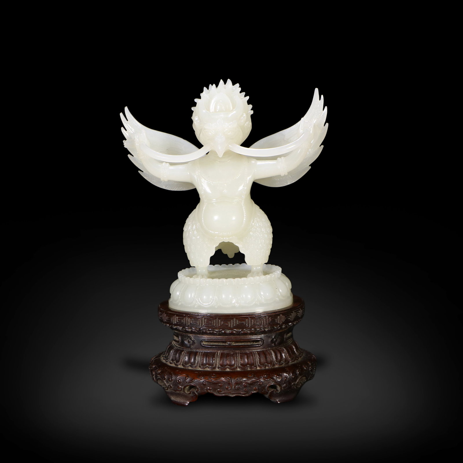 Qing Dynasty Hetian white jade carved Garuda statue: Name Qing Dynasty Hetian white jade carved Garuda statue Dimensions H:10.6cm W:10.1cm Description