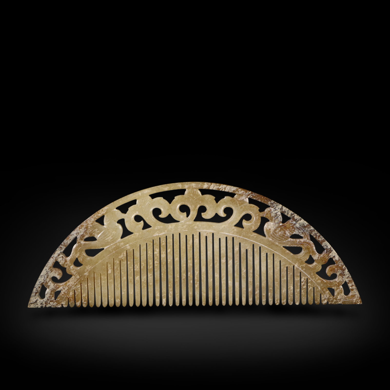 Tang Dynasty Jade comb carved with flower and bird patterns: Name Tang Dynasty Jade comb carved with flower and bird patterns Dimensions H:4.5cm W:12.3cm Description