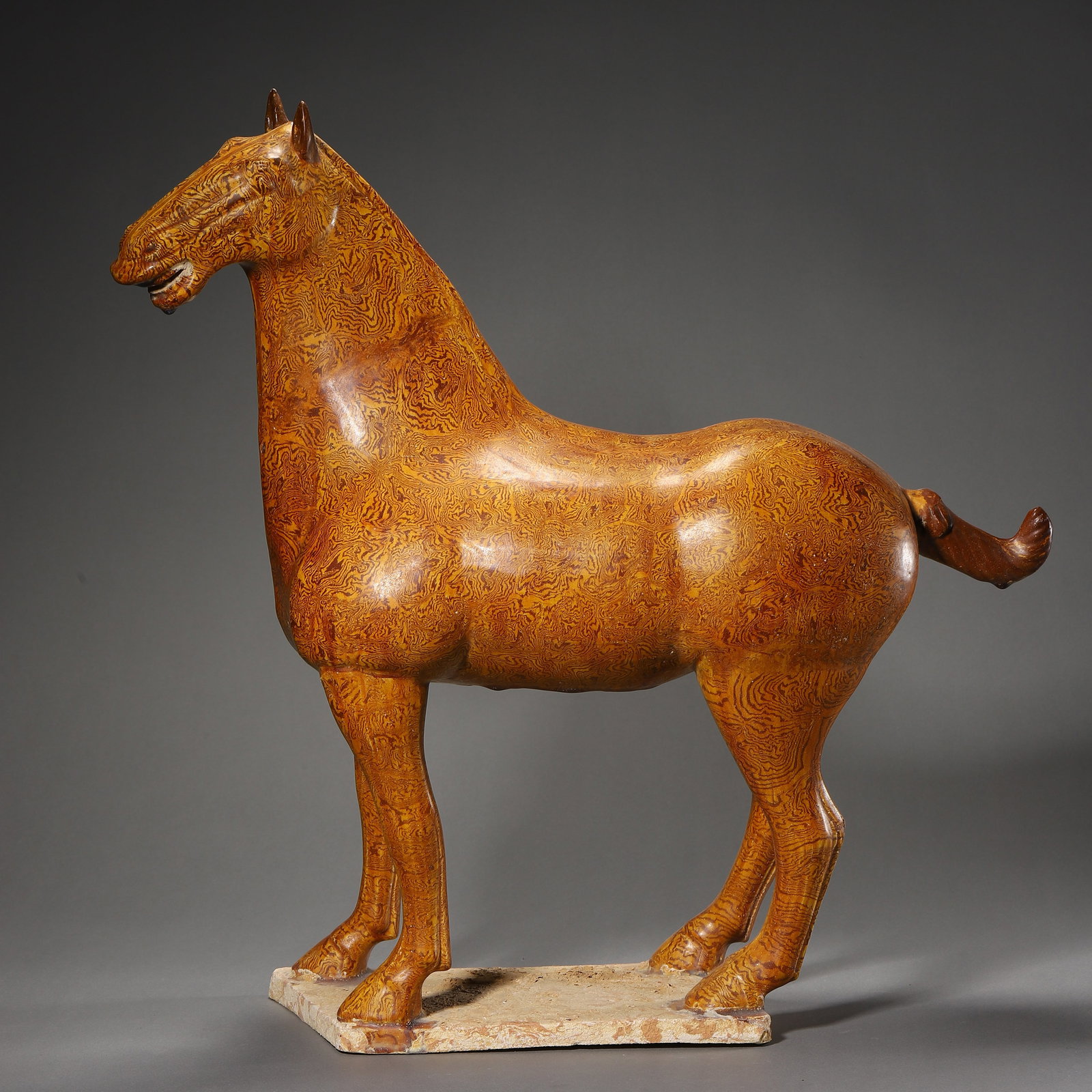 Tang Dynasty Marbled clay pottery horse: Name Tang Dynasty Marbled clay pottery horse Dimensions H:50cm W:50cm Description