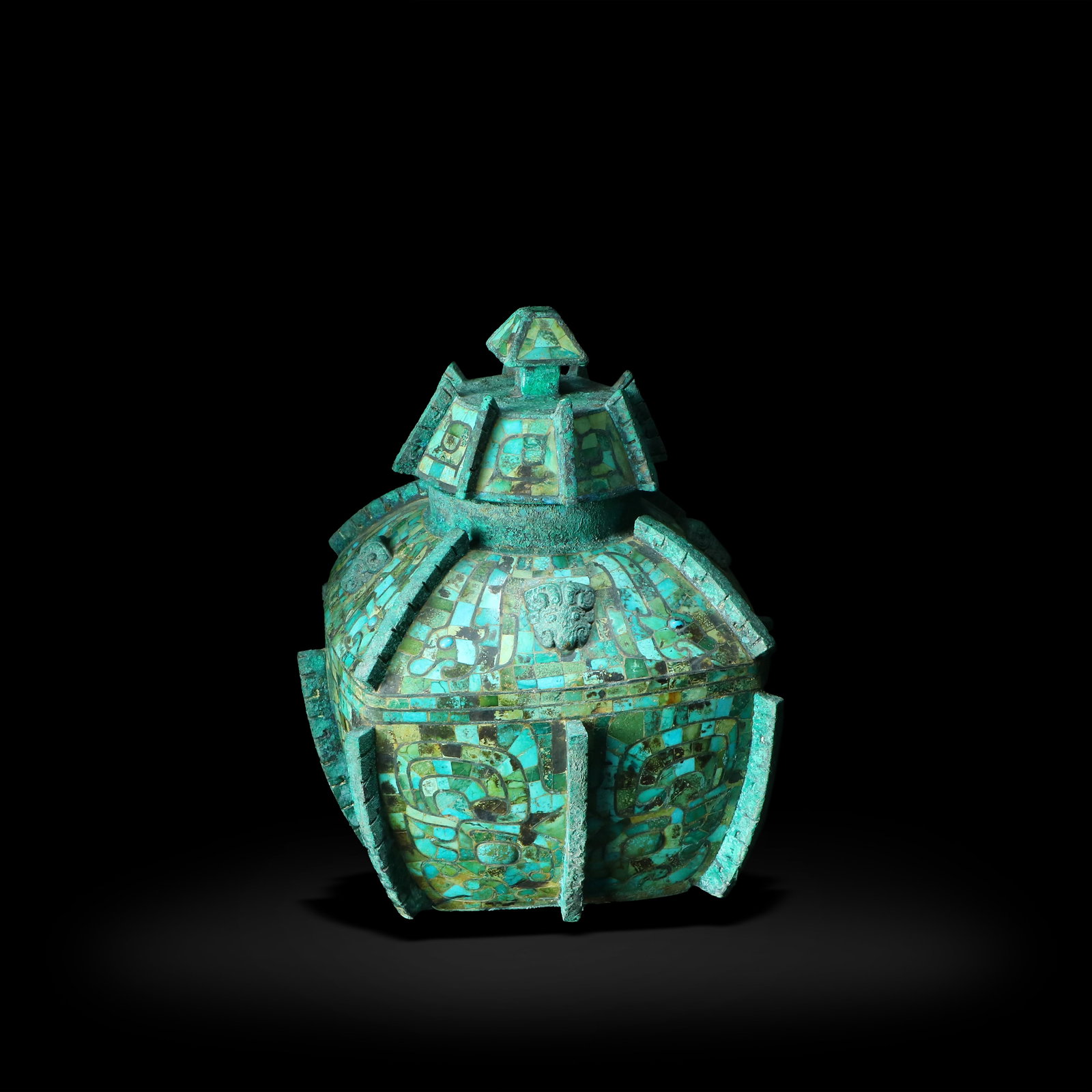 Shang Dynasty Bronze lei inlaid with turquoise, decorated with taotie motifs: Name Shang Dynasty Bronze lei inlaid with turquoise, decorated with taotie motifs Dimensions H:21cm W:17.5cm Description