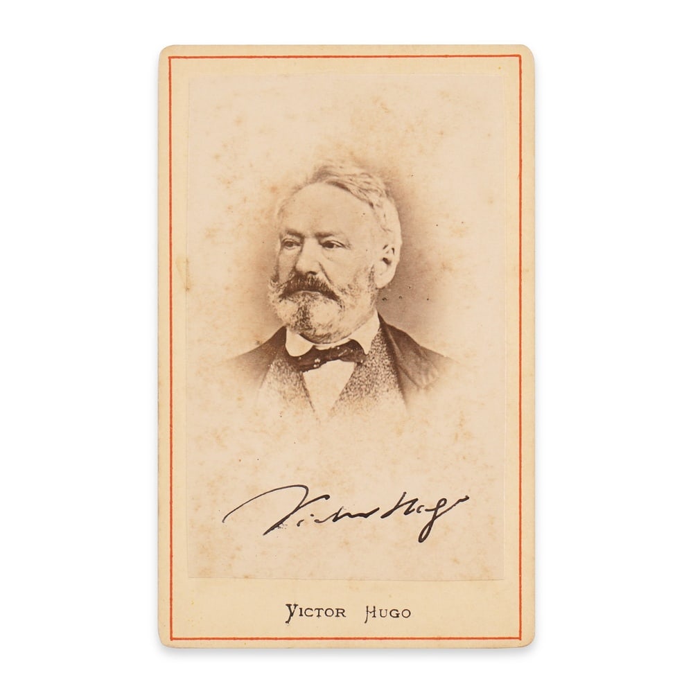 VICTOR HUGO, SIGNED CARTE DE VISITE: 3 7/8 x 2 1/2 in (10 x 6.2 cm) This signed carte de visite presents a rare and dignified portrait of Victor Hugo, one of the most influential literary figures of the nineteenth century. As the author