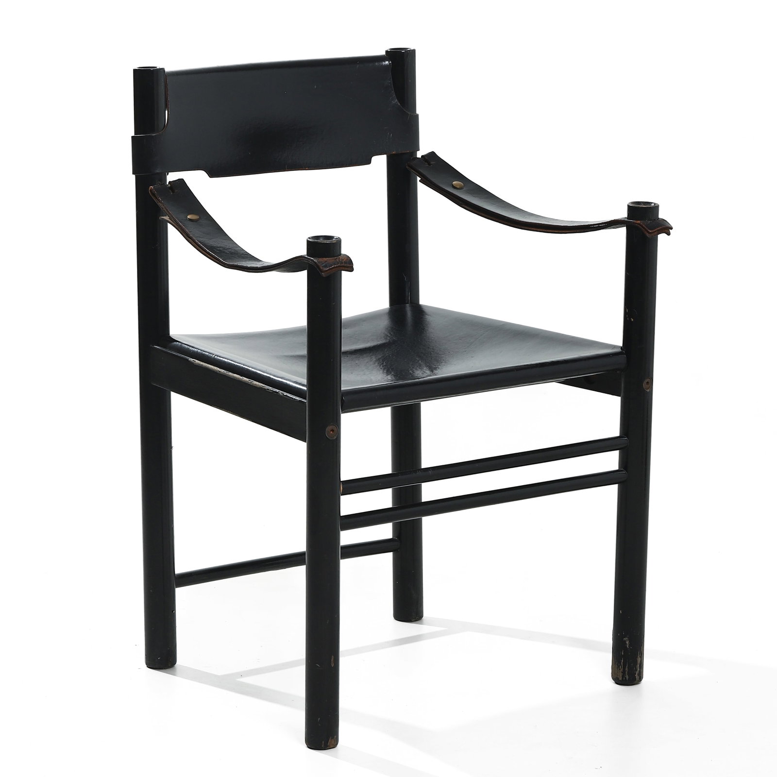 MARCO ZANUSO, A BLACK LACQUERED WOOD AND LEATHER ARMCHAIR, STUDIO SIMON, ITALY, 1970s: Dimensions Height: 30 3/4 in (78 cm); Seat height: 17 1/4 in (44 cm); Width: 22 in (56 cm) Description This armchair, designed by Marco Zanuso for Studio Simon, exemplifies the refined Italian moderni