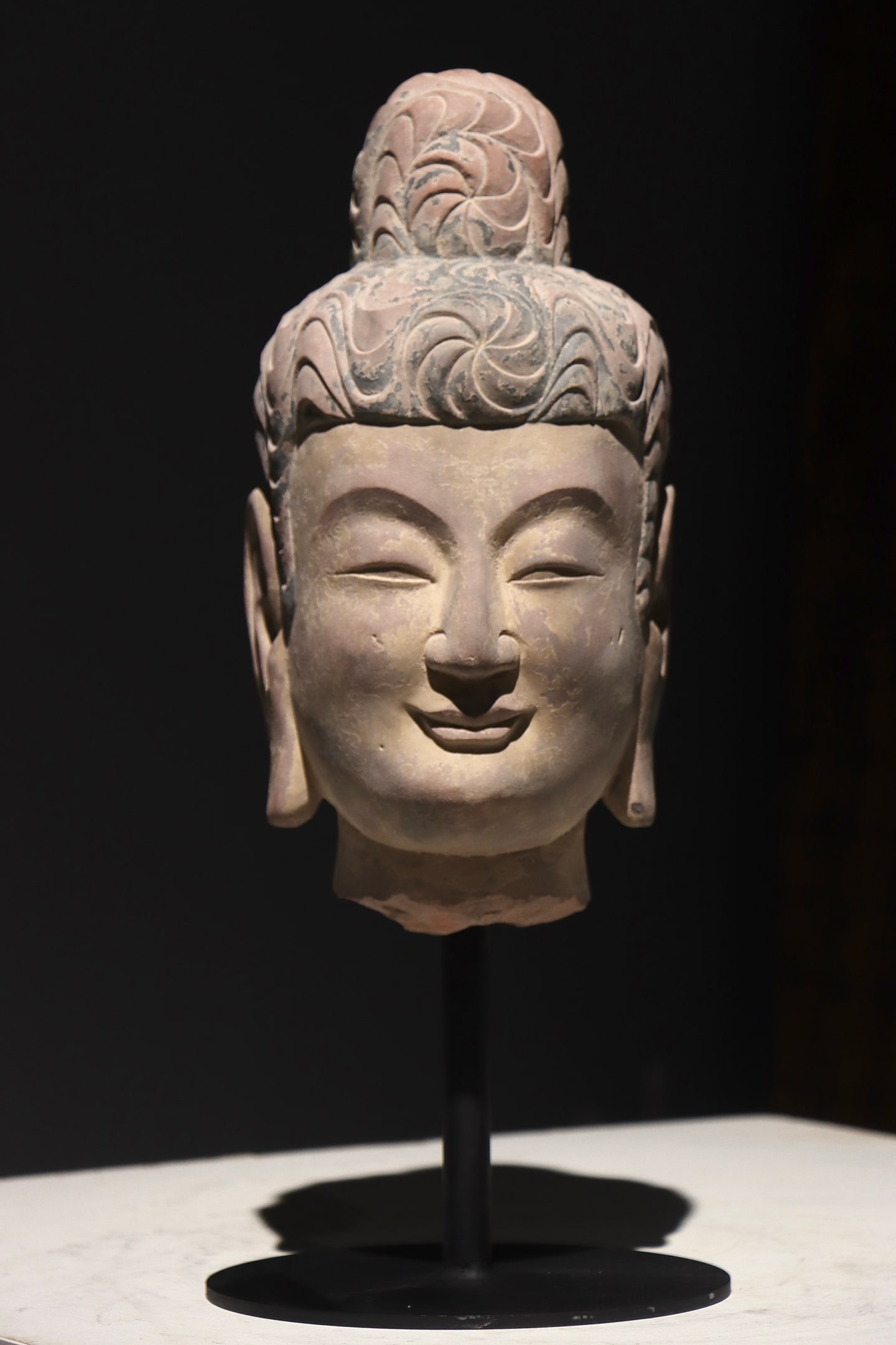 A RED SANDSTONE HEAD OF SAKYAMUNI BUDDHA FROM THE SUI DYNASTY (1 of 9)