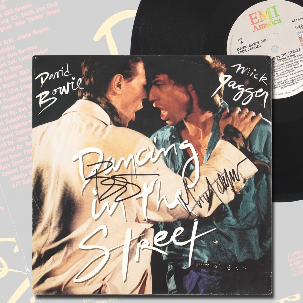 DAVID BOWIE & MICK JAGGER, FULLY SIGNED DANCING IN THE STREET LP: 12 1/4 x 12 1/4 in Provenance and Authentication: This lot is accompanied by supporting documentation provided by the consignor. According to the accompanying materials, the signature was reviewed wit