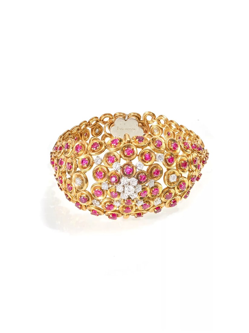 French 1950s Boucheron 18K Gold Ruby and Diamond Bracelet: Bracelet Length:18cm Bracelet Width:1.5-3.4cmWt:62.1g This piece is a signature antique jewel by Boucheron, France, dating to the 1950s. It perfectly embodies the house's core aesthetic of "naturalism