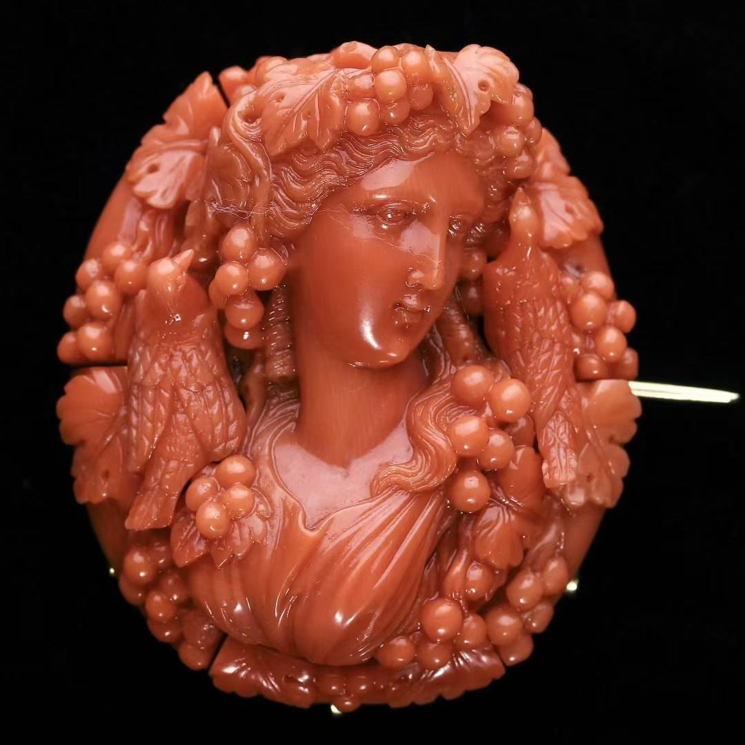 Georgian Period (1714-1837) High-Relief Bacchus Cameo Brooch: 4.9*4.2*2.4cm Wt:34.3g The pin assembly and mounting are hand-crafted in 12K gold. Master-level carving renders a bust of the Greek god of wine, encircled by grape vines and two white doves. Boasting 