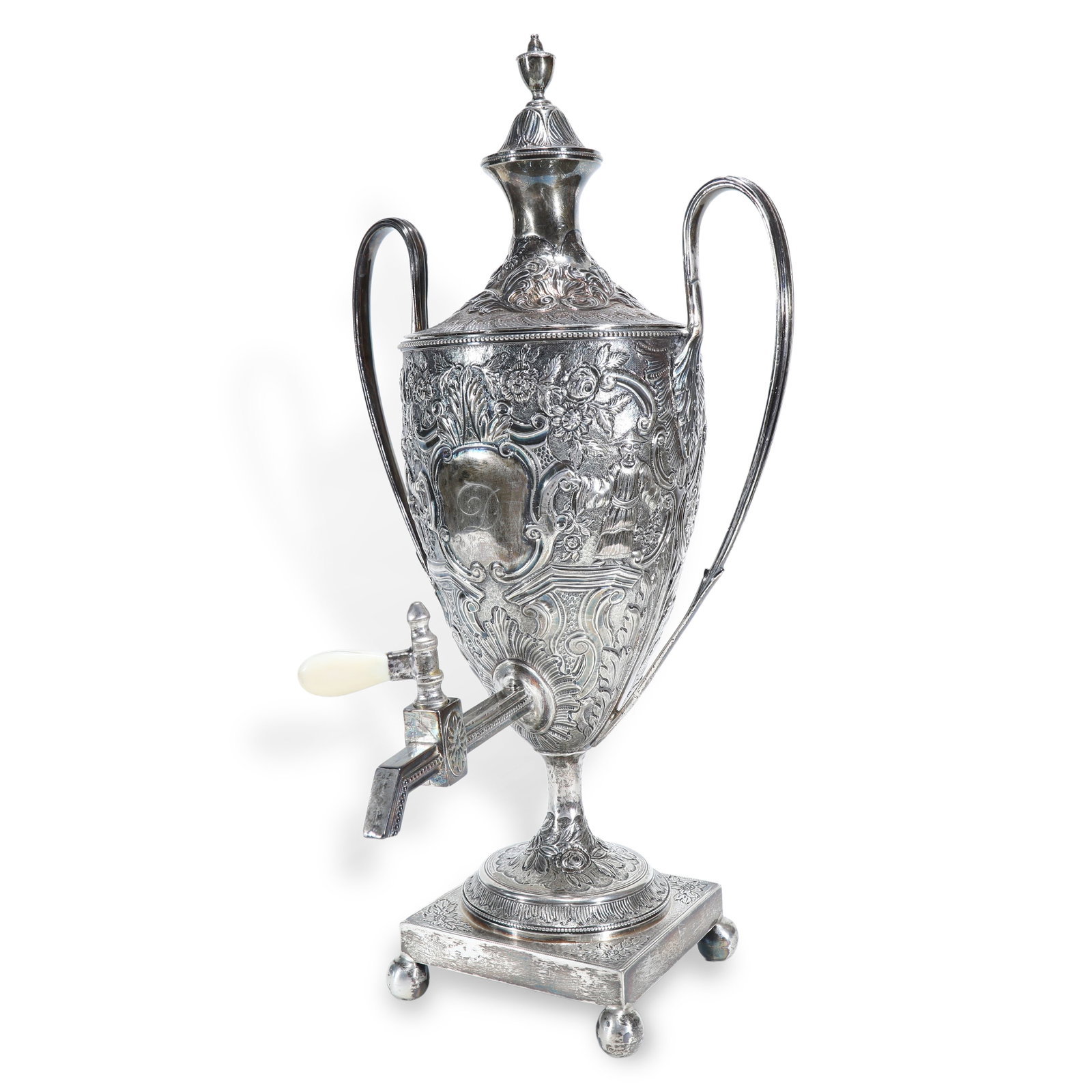 British Georgian Period (Dated 1789) Pastoral-Themed Sterling-Silver Water Jug with Spigot: H:39.5cm W:20.5cm Wt:1327g
