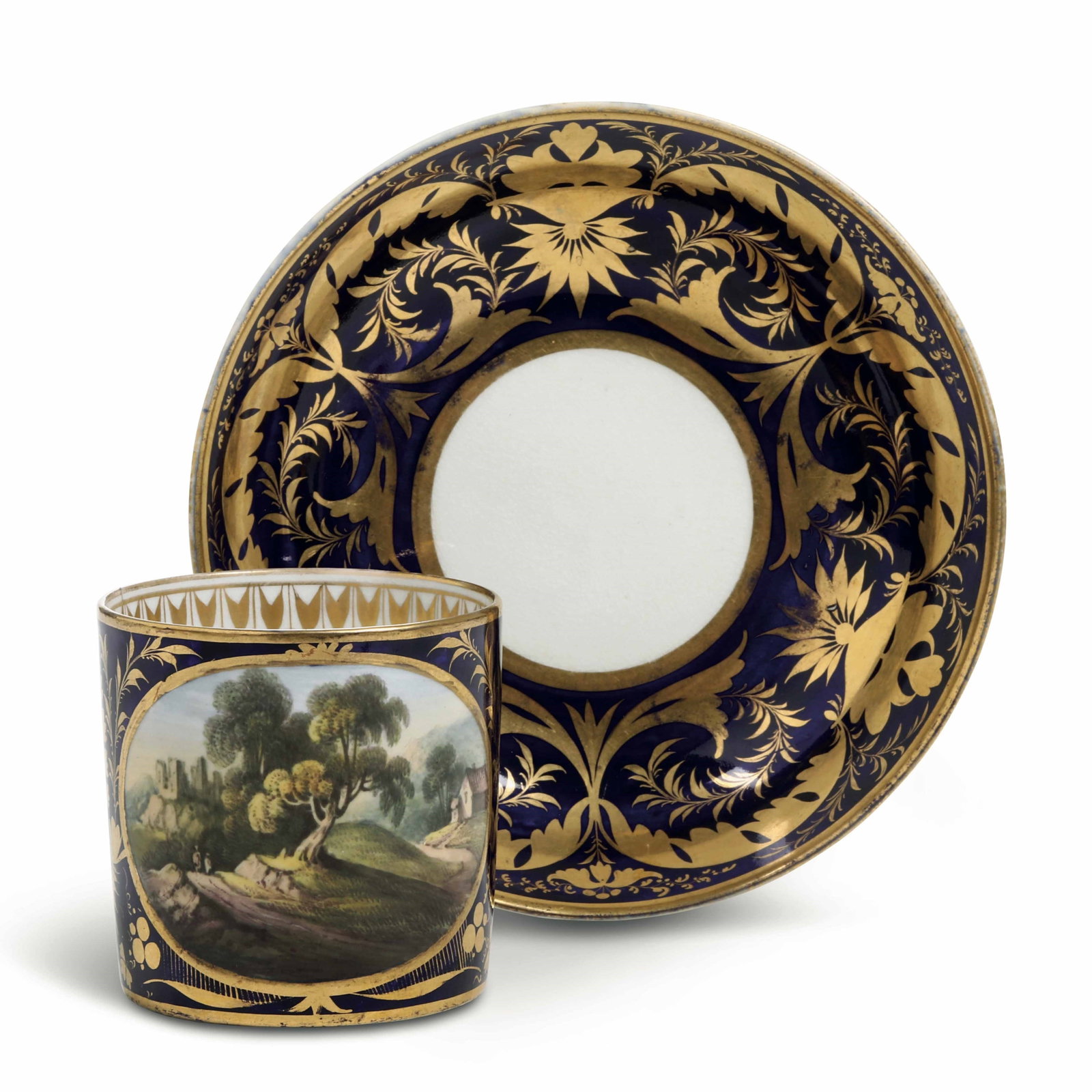 c.1800 Deep Blue Glazed Heavy Gilt Porcelain Cup and Saucer with English Rural Scene: D:7cm H:6.7cm/D:14.3cm Material: Porcelain, Gilt GoldDimensions: Cup - Diameter 7 cm, Height 6.7 cm; Saucer - Diameter 14.3 cmOrigin: Royal Crown Derby Porcelain Manufactory, England (Founded 1750 - P