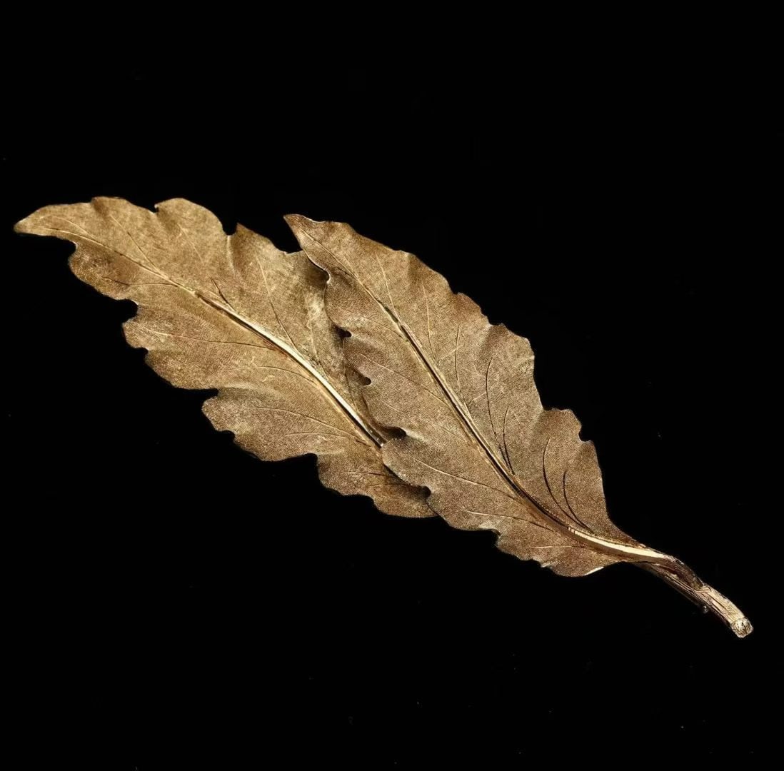 Buccellati Three-Dimensional Chased-Gold Leaf Brooch, Work by Mario Buccellati (Founder-Generation),: 11.5*3.4cm Wt:24.9g Fully hand-carved, exhibiting strong three-dimensional presence and extraordinary craftsmanship. Noble and grand in design, in immaculate condition. Hand-engraved signature of Mari