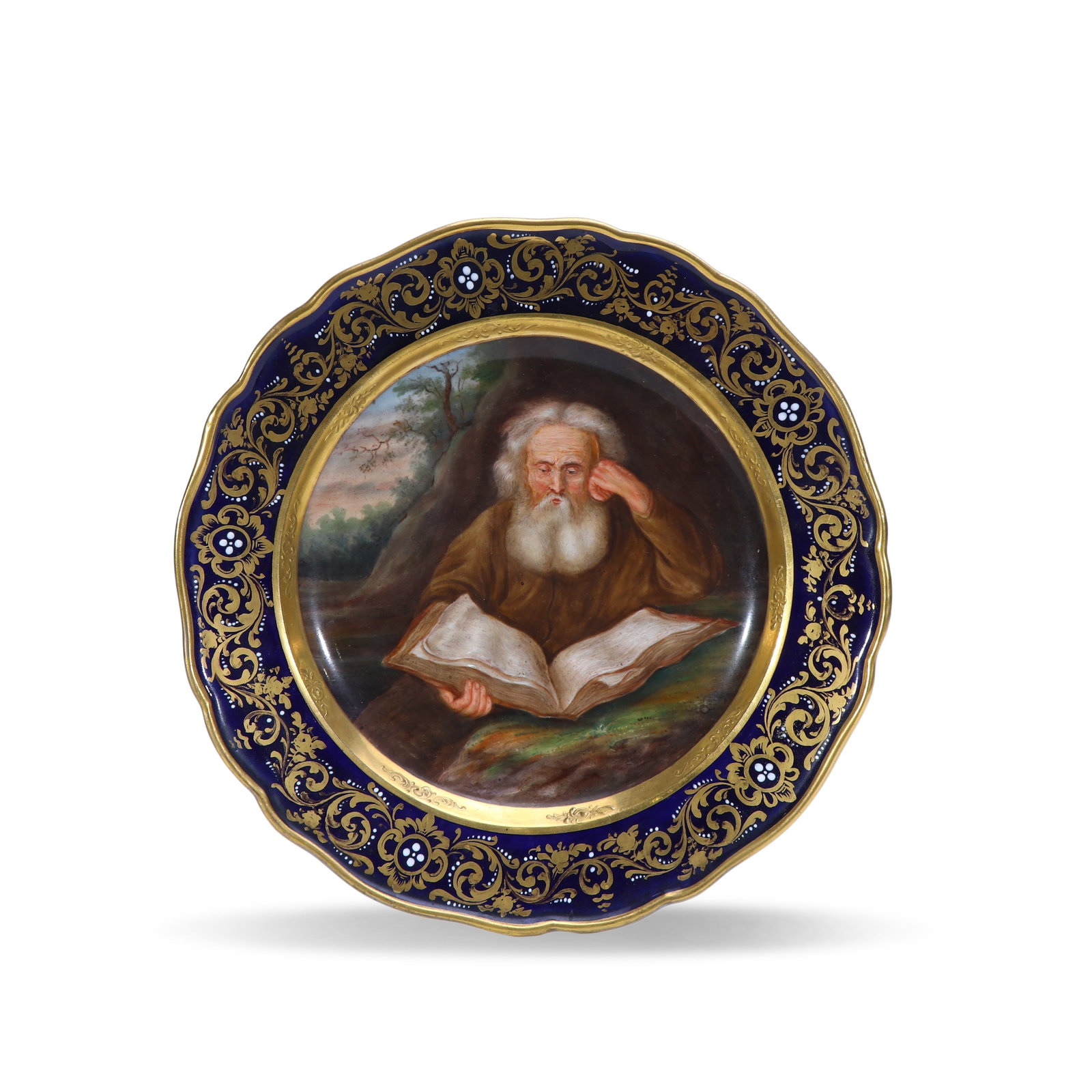 19th Century Meissen Hand-Painted Cabinet Plate with Hermit Portrait, Cobalt Blue and Gilt: D:24cm Deep within a mountain grotto, an elderly hermit with long white hair and beard is draped in a brown monk's robe, poring over an unfurled scroll and cupping one ear to ponder intently.The hermi