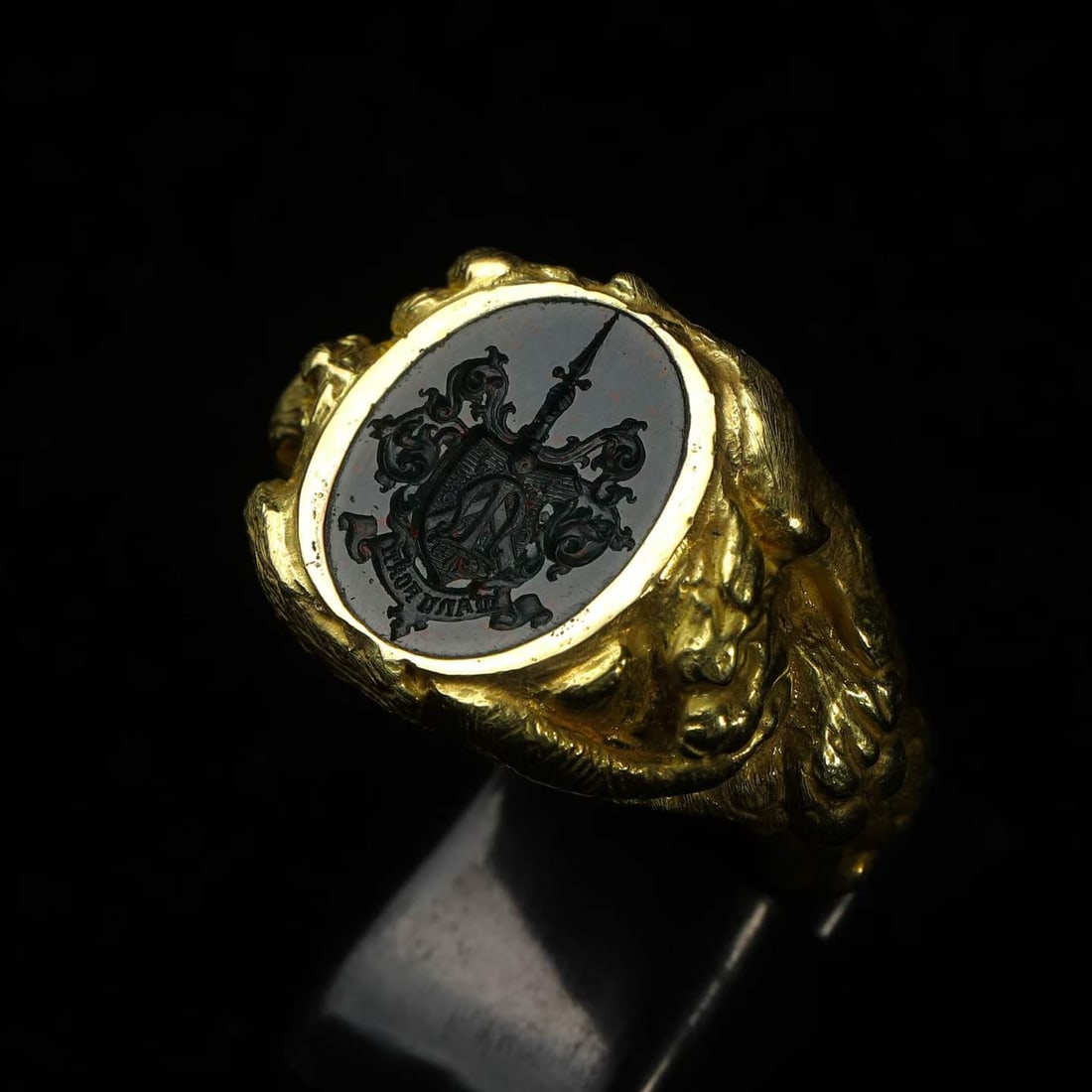 Art Nouveau Period (1880-1920) 18K Three-Dimensionally-Chased Gold Heraldic Ring: Ring Size: US 9.5-10 Wt:16g The shank features an entwined composition of a spirit serpent, a phoenix and a flying dragon. The bezel bears a heraldic device: a shield-shaped family crest combined with