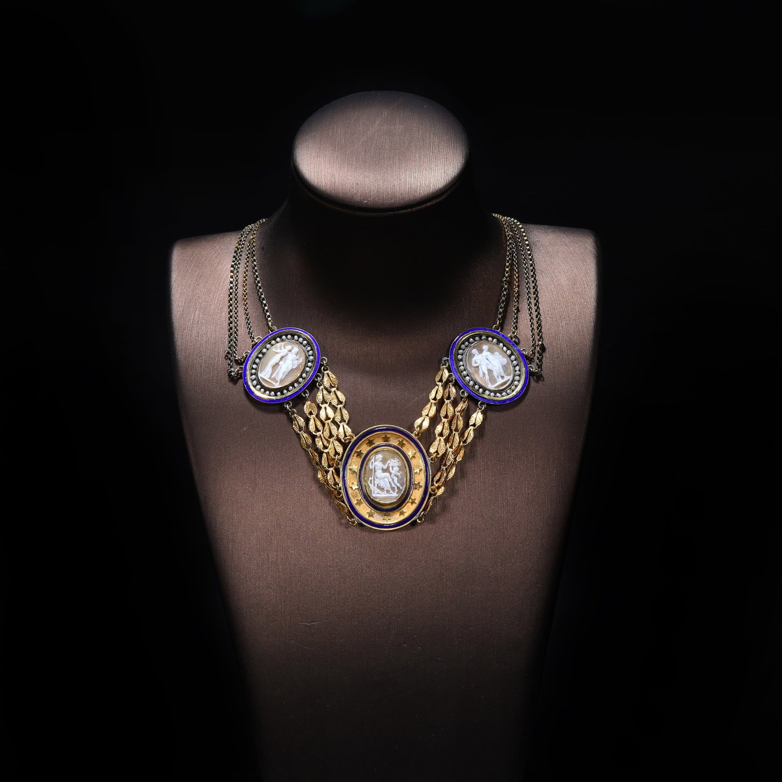 French Napoleonic-Era 18K Gold / Shell Cameo Natural-Pearl Necklace: Chain Length:36.5cm Wt:25.22g Mythological-themed jewel, decorated with seed-pearls and blue enamel. The majority of the metalwork is 18K gold, with small side elements executed in gilt-silver. The cl