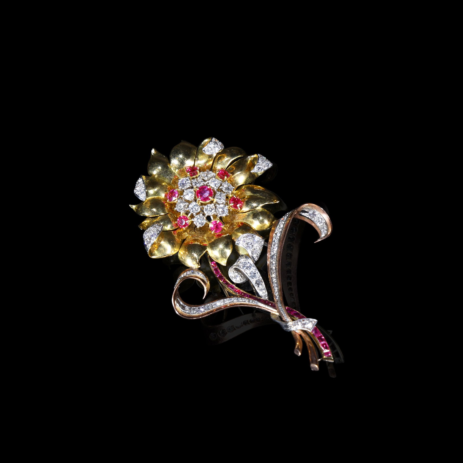 Retro Period 18K Tri-Colour Gold Large Sunflower Brooch Set with Diamonds and Rubies: L:9.3cm W:5.8cm Wt:38.4g Accompanied by a GIA certificate. Set with diamonds totalling approximately 5 ct and an unheated Burmese ruby weighing approximately 2 ct.