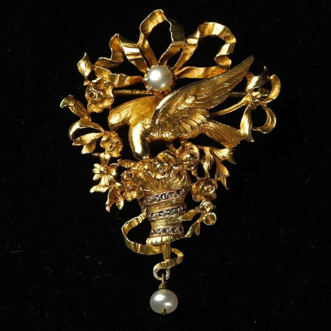 Art Nouveau Period (1880-1920) French Antique White-Dove-and-Flower-Basket 18K Gold Brooch: 4.9x3.5cm Wt:12.5g With outstretched wings, the central dove gently touches a blooming flower basket with the tip of its lowered beak. Devoid of the ferocity of birds of prey, it radiates gentle grace