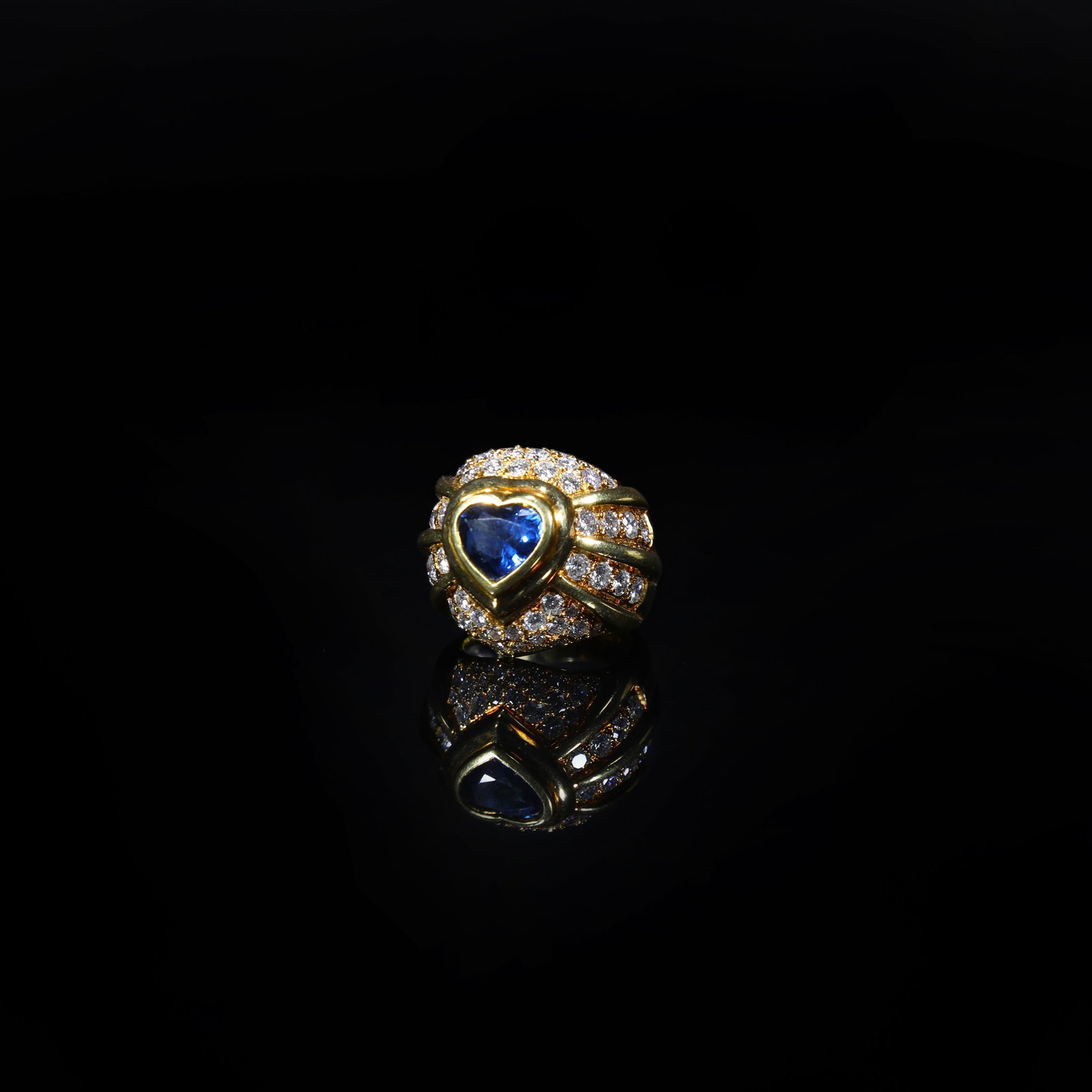 18K Gold Heart-Shaped Sapphire and Diamond-Set Ring: Stone Dimensions2.3cm *2.1cm Wt:17.8g Ring Size: US 6.5-7 Centred with a heart-shaped main stone weighing approximately 3 ct, accented with diamonds totalling approximately 1.5 ct.
