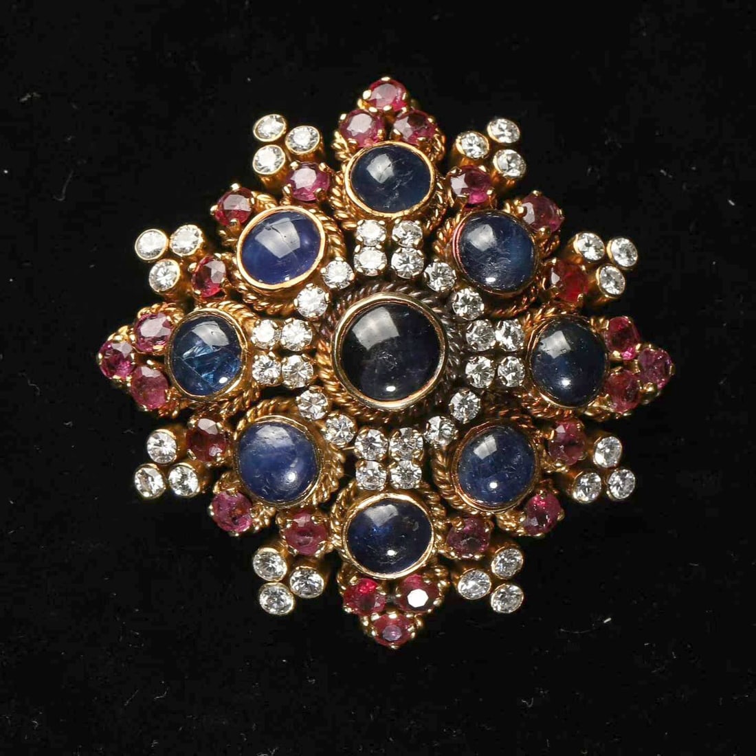 Ilias Lalaounis Byzantine-Style 18K Gold Brooch Set with Sapphires, Rubies and Diamonds: 4.8*4.8cm Wt:29.3g Inspired by the millennial splendour of the Byzantine Empire, Greek national-treasure jeweller Ilias Lalaounis distils the opulent aesthetic of the Eastern Roman court into this hei