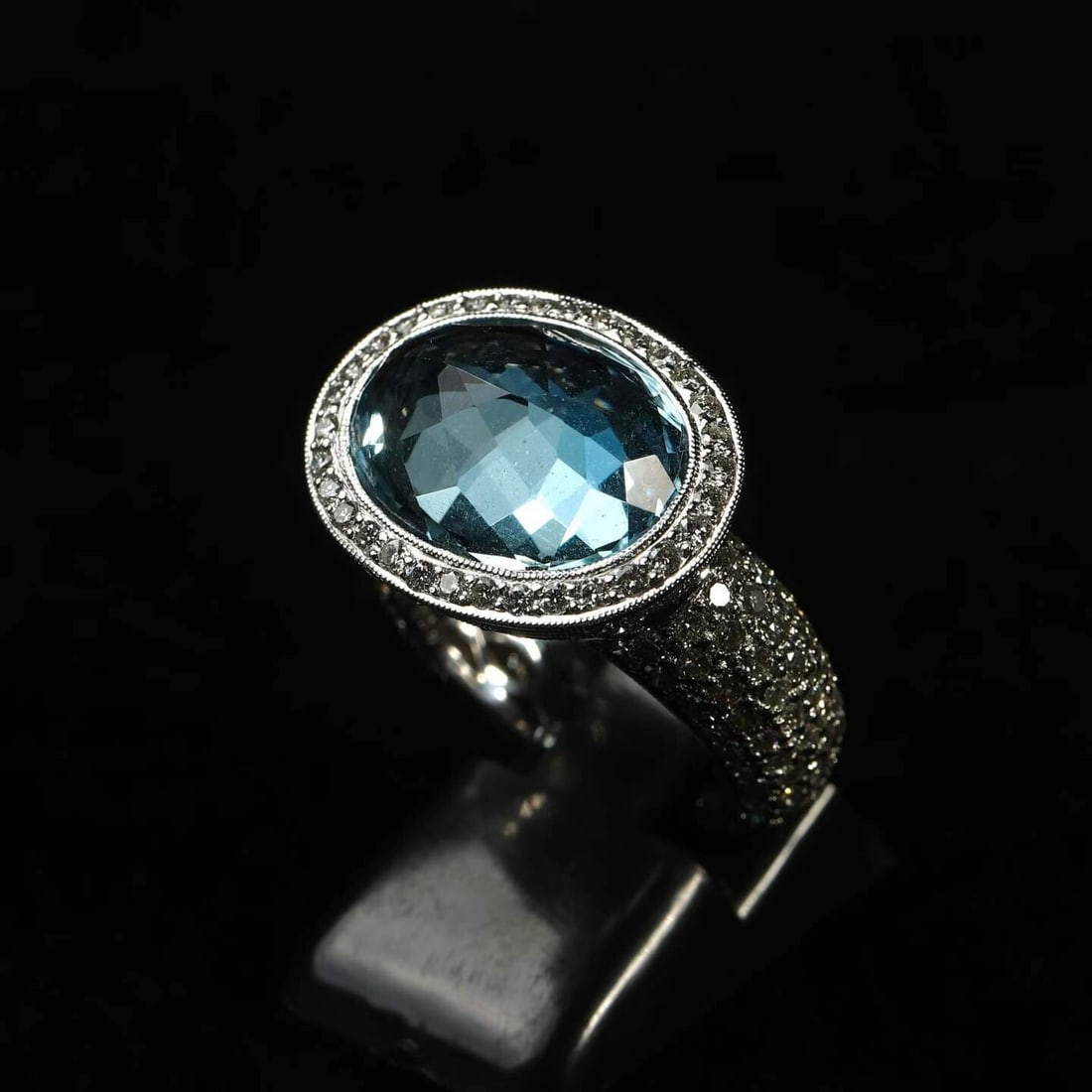 Art Deco Period (1925-1935) Antique Heavily-Set Diamond Ring with Santa-Maria-Colour Aquamarine: Ring Size: US 7.5 Wt:12.4g 8.08 ct Natural Santa-Maria-Colour Aquamarine and Diamond Ring, GUILD-Certified The oval modified brilliant-cut main stone is graded Vivid Blue by GUILD, awarded the Santa M