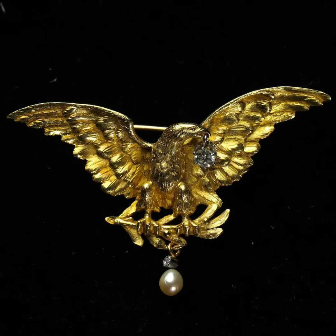 Art Nouveau Period (1880-1920) French 18K Gold Eagle Brooch: 6.5*4.2cm Wt:19.65g Entirely hand-sculpted in 18K gold, the artisan captures the dramatic instant of an eagle diving to seize an olive branch with masterly craftsmanship and powerful artistic