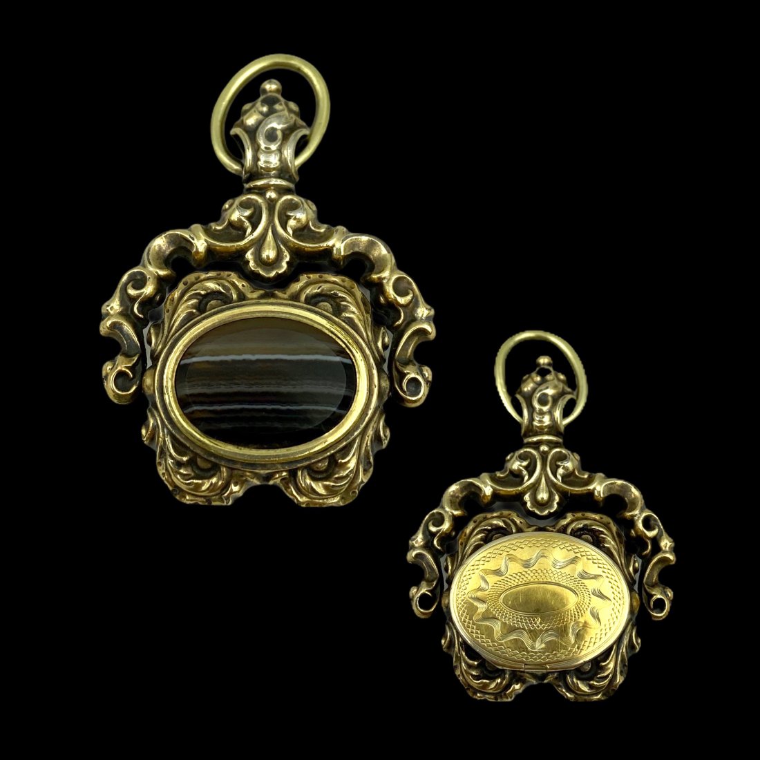 Victorian Gold Swivel Fob With Locket: 14K. Banded agate inset and hidden locket verso. Measures 1 3/4 T x 1 1/4 W. Weight 13.3g. Good condition, with one very minor dent on locket cover.