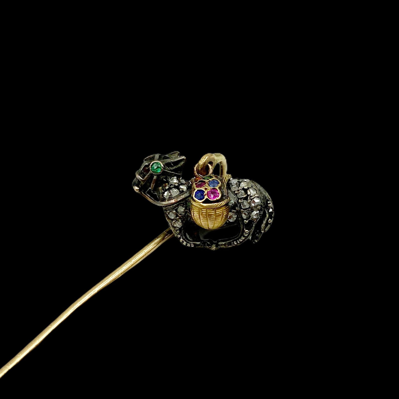 Antique Gold Gem Set Donkey Stickpin: Set with natural ruby, emerald, sapphire, and diamonds. Missing 3 stones inside of basket. Donkey 18K and silver, stick 14K. Measures 3Ã‚”T x 3/4Ã‚”W. Weight 5.6 grams.